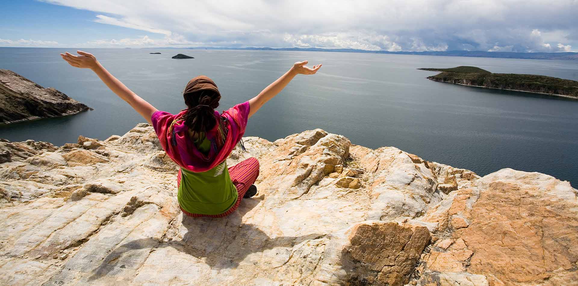 Woman overlooking Lake Titicaca, Peru