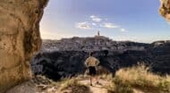 Italy Puglia man overlooking town