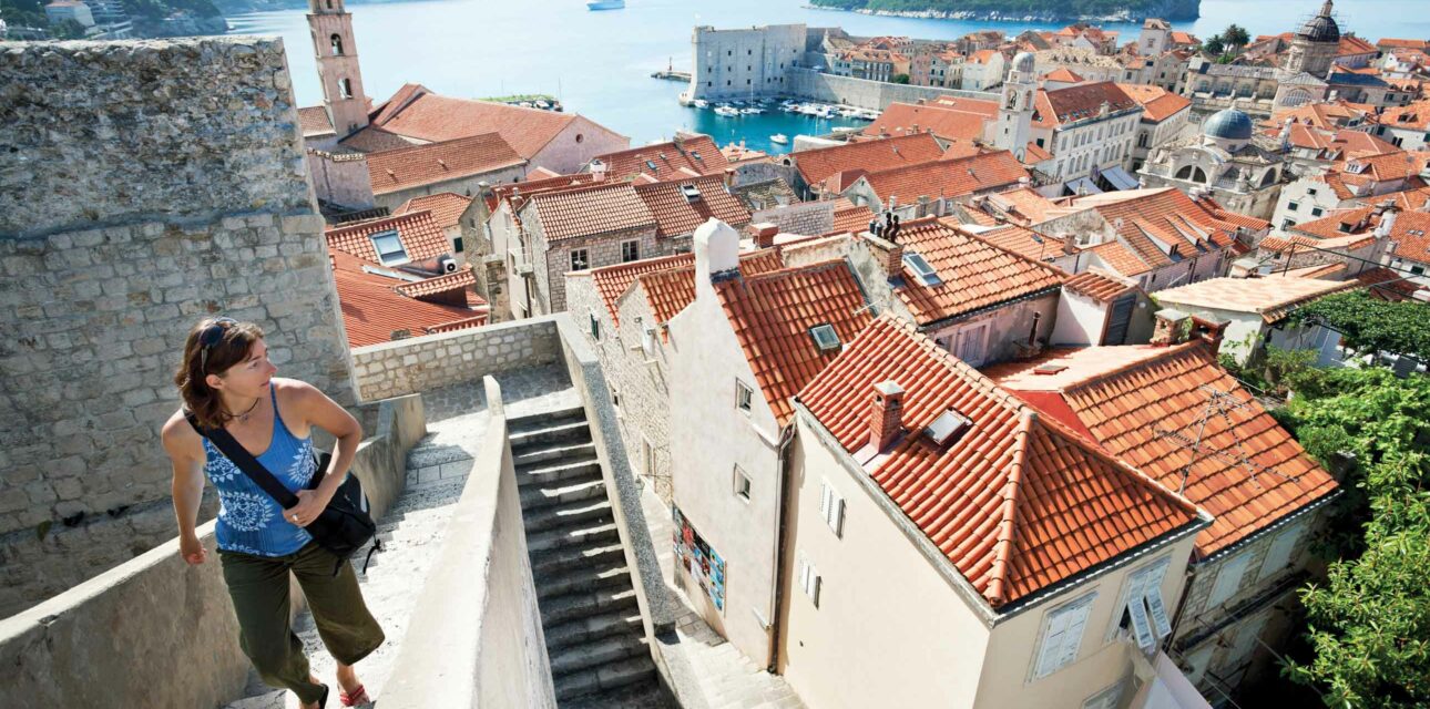 A woman walking up stairs in Croatia