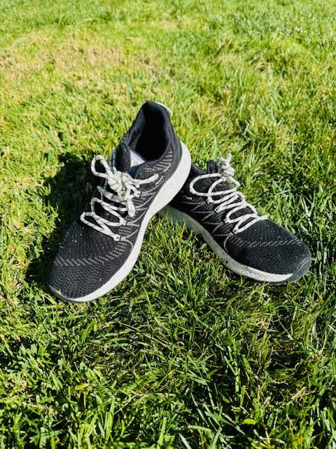 Pair of black Merrell Bravada 2 waterproof shoes in the grass