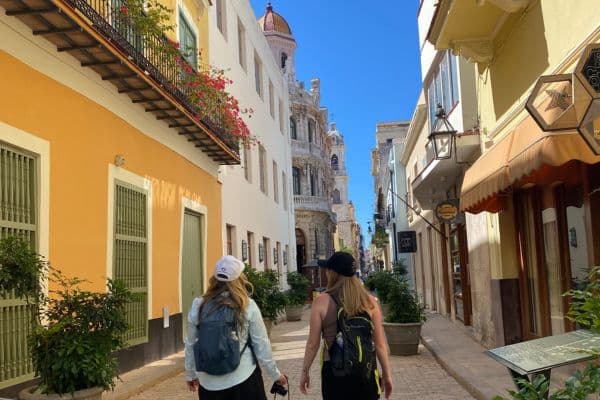 Women walking down the street of Havana, Cuba