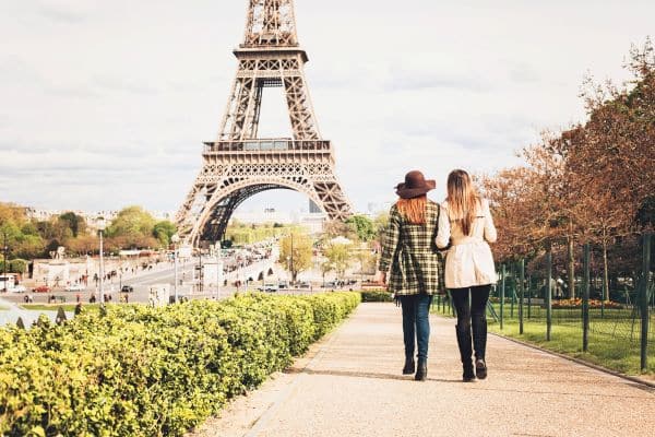 Women walking in Paris with the Eiffel Tower in the background 