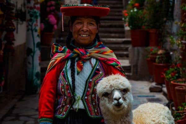 Peruvian woman with an alpaca