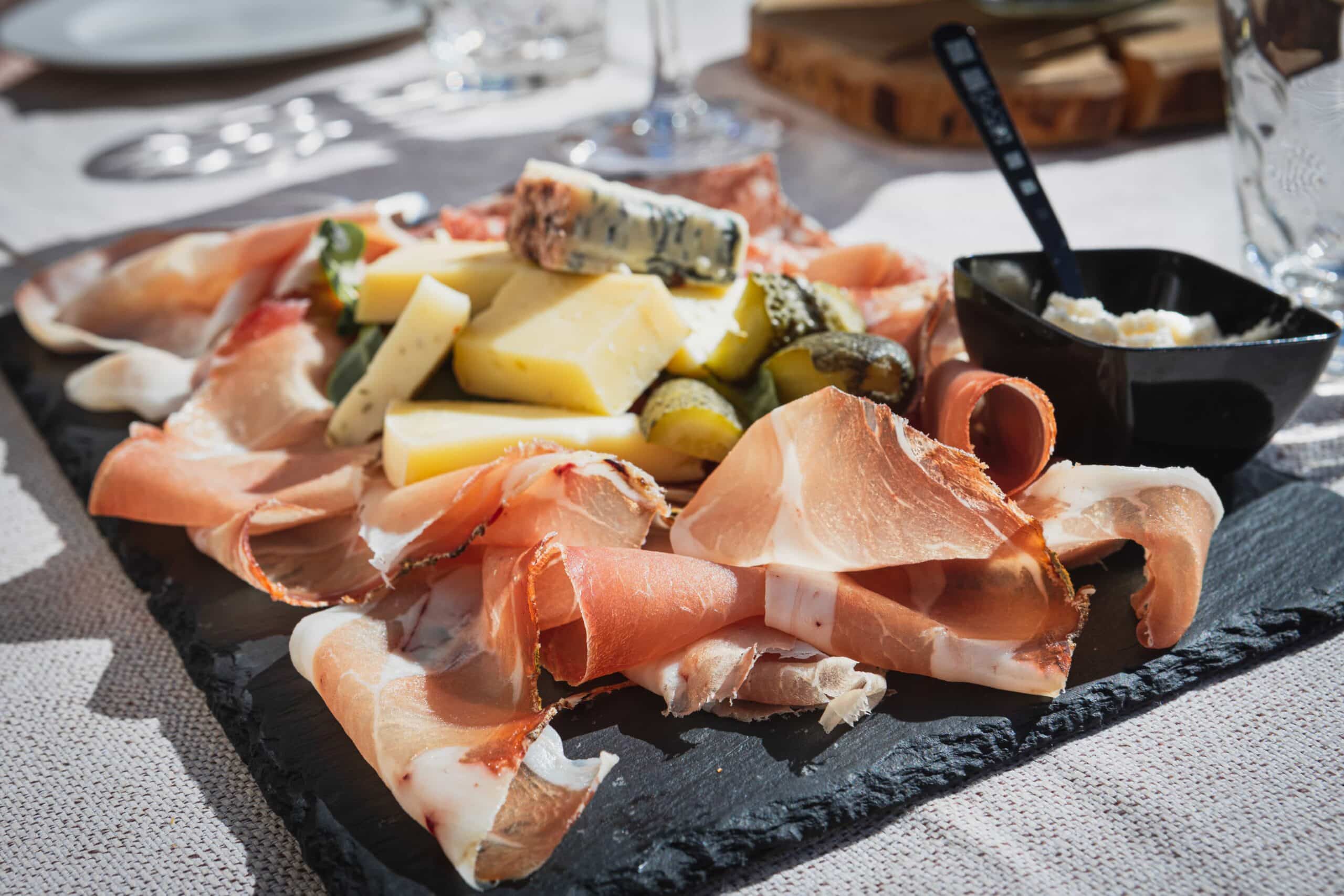 Charcuterie platter, meats and cheeses, Dolomites, Italy