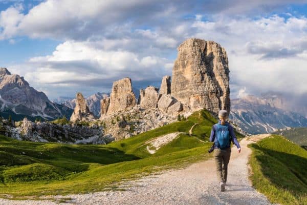 Hiker walking on trail in the Cinque Torri in Italy's Dolomites region