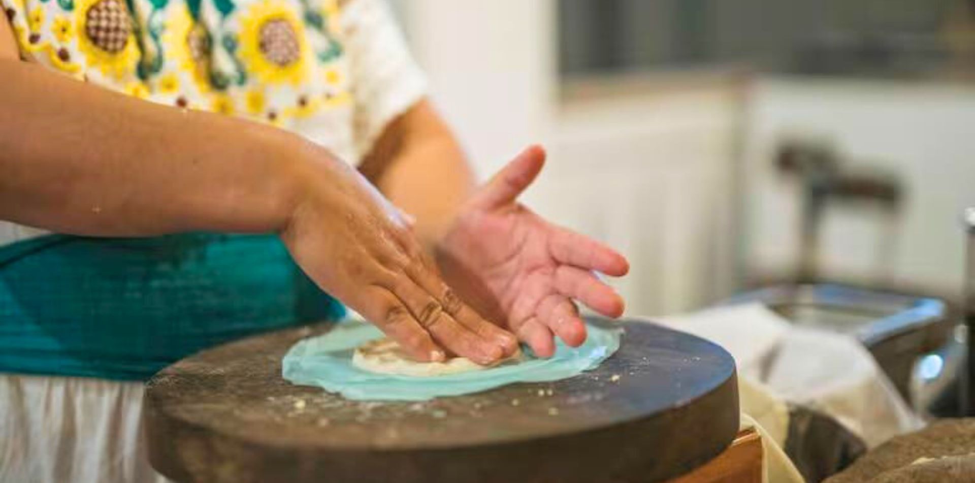 In San Antonio, meet some of the local women and learn from them how they grind the corn for your homemade tortillas for lunch