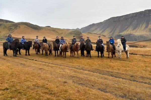 Guests on horseback in Iceland for a memorable tour around the scenic property of Skalakot Manor