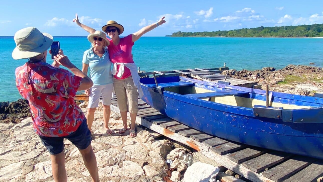 Guests in Cuba taking a iphone picture by the coast